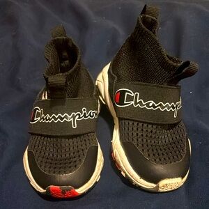 Champion tennis shoes.